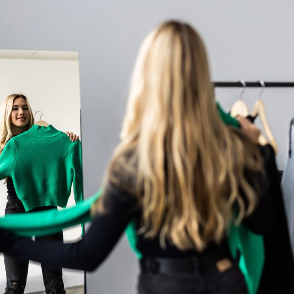 young-pretty-woman-looking-into-mirror-near-wardrobe-home young-pretty-woman-looking-into-mirror-near-wardrobe-home
